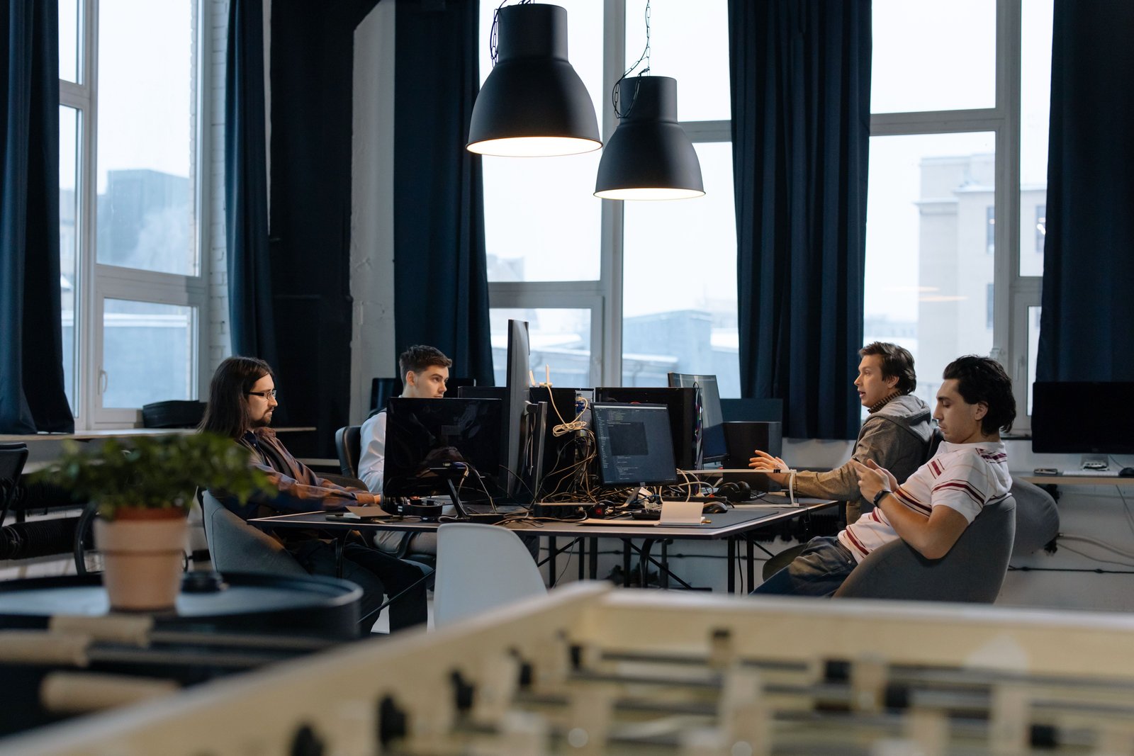 Workers collaborating in a contemporary office on technology initiatives