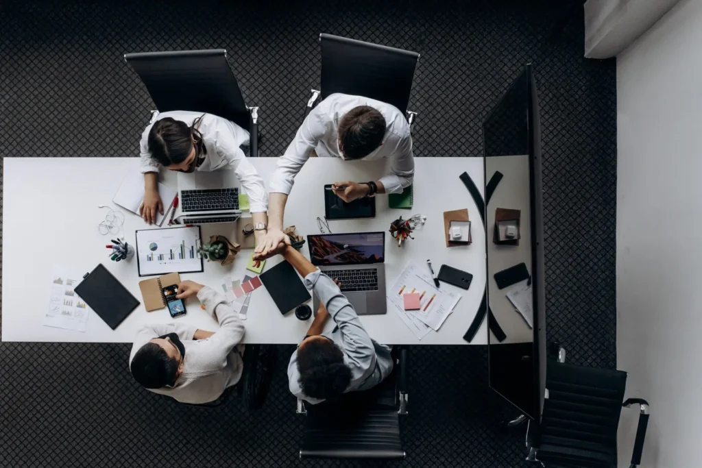 Colleagues collaborating around a conference table on a change framework