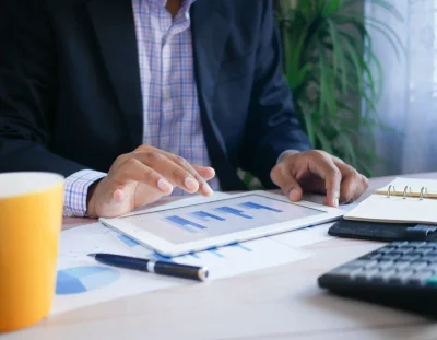 professional analyzing data tablet modern office